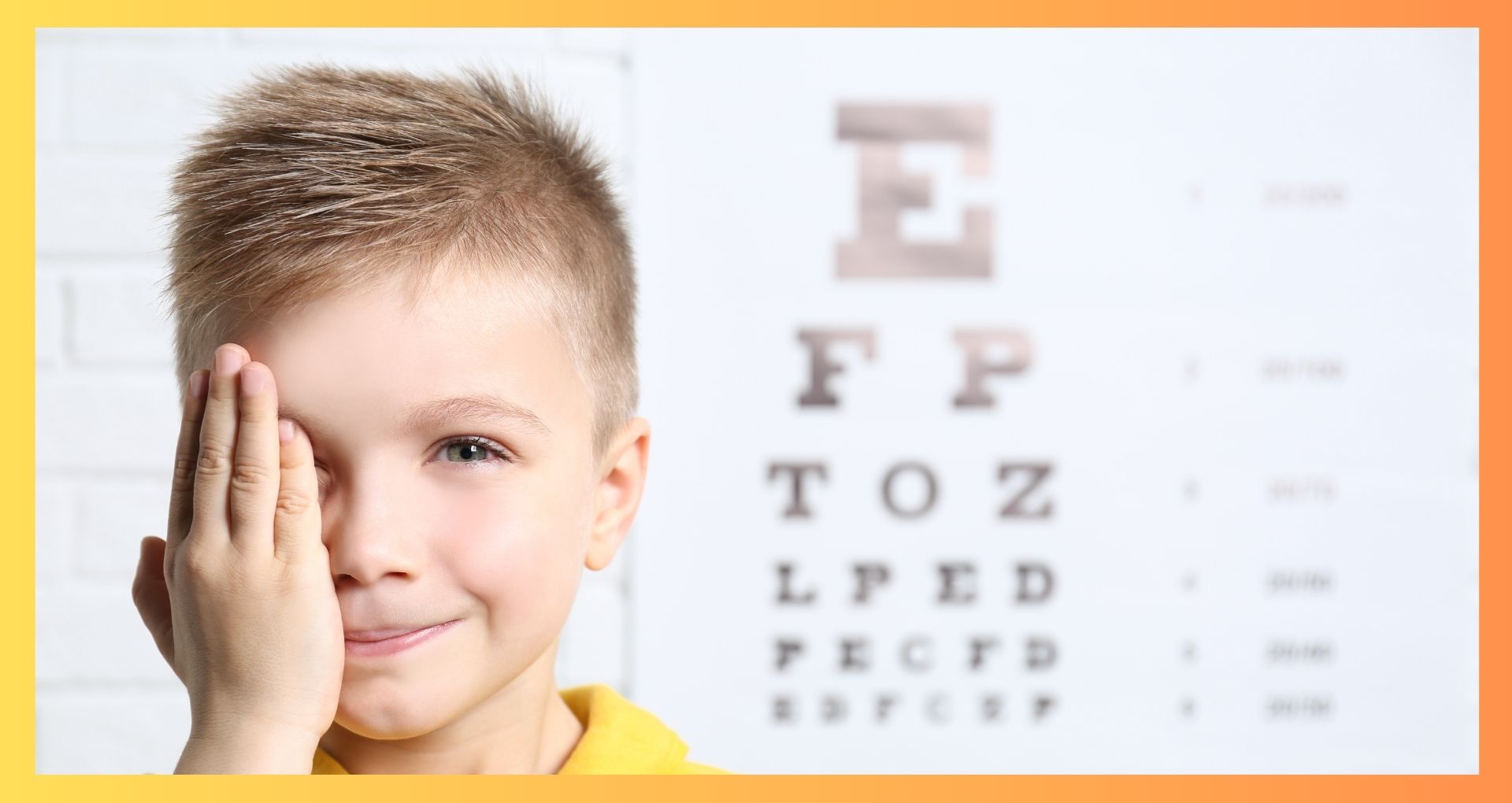 Young boy having a routine eye exam with eye chart